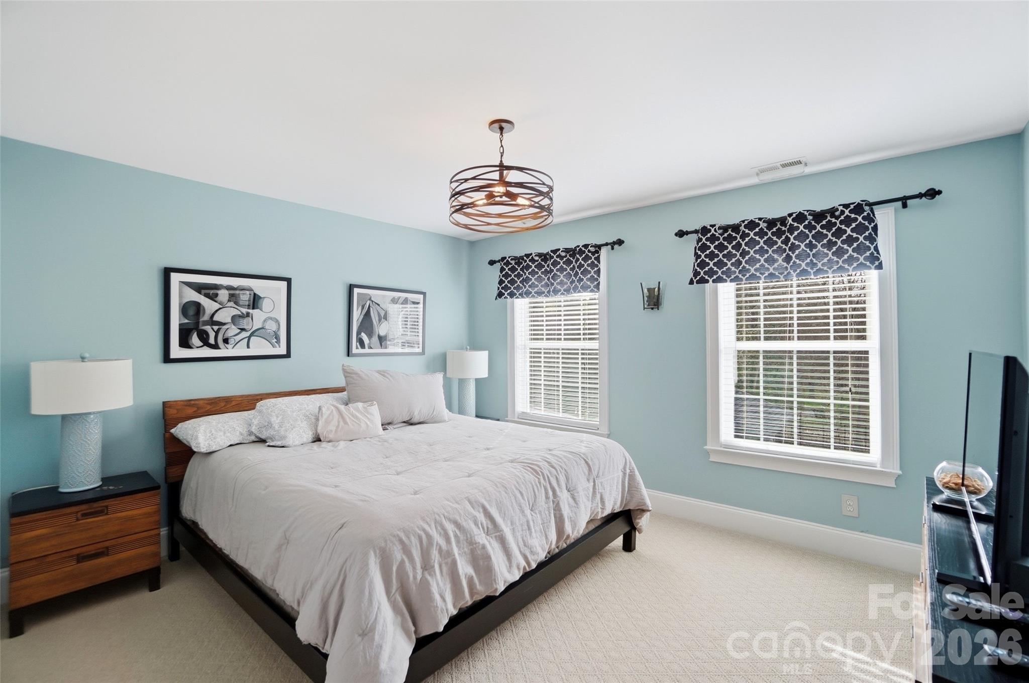 704 Mayfield Court Fort Mill, SC 29715 - Photo 33 of 48 a bedroom with a bed and a window