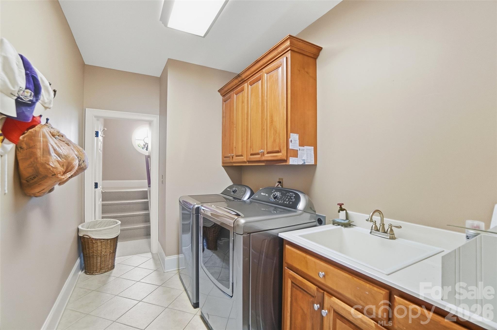 704 Mayfield Court Fort Mill, SC 29715 - Photo 36 of 48 a utility room with a sink a washer and dryer