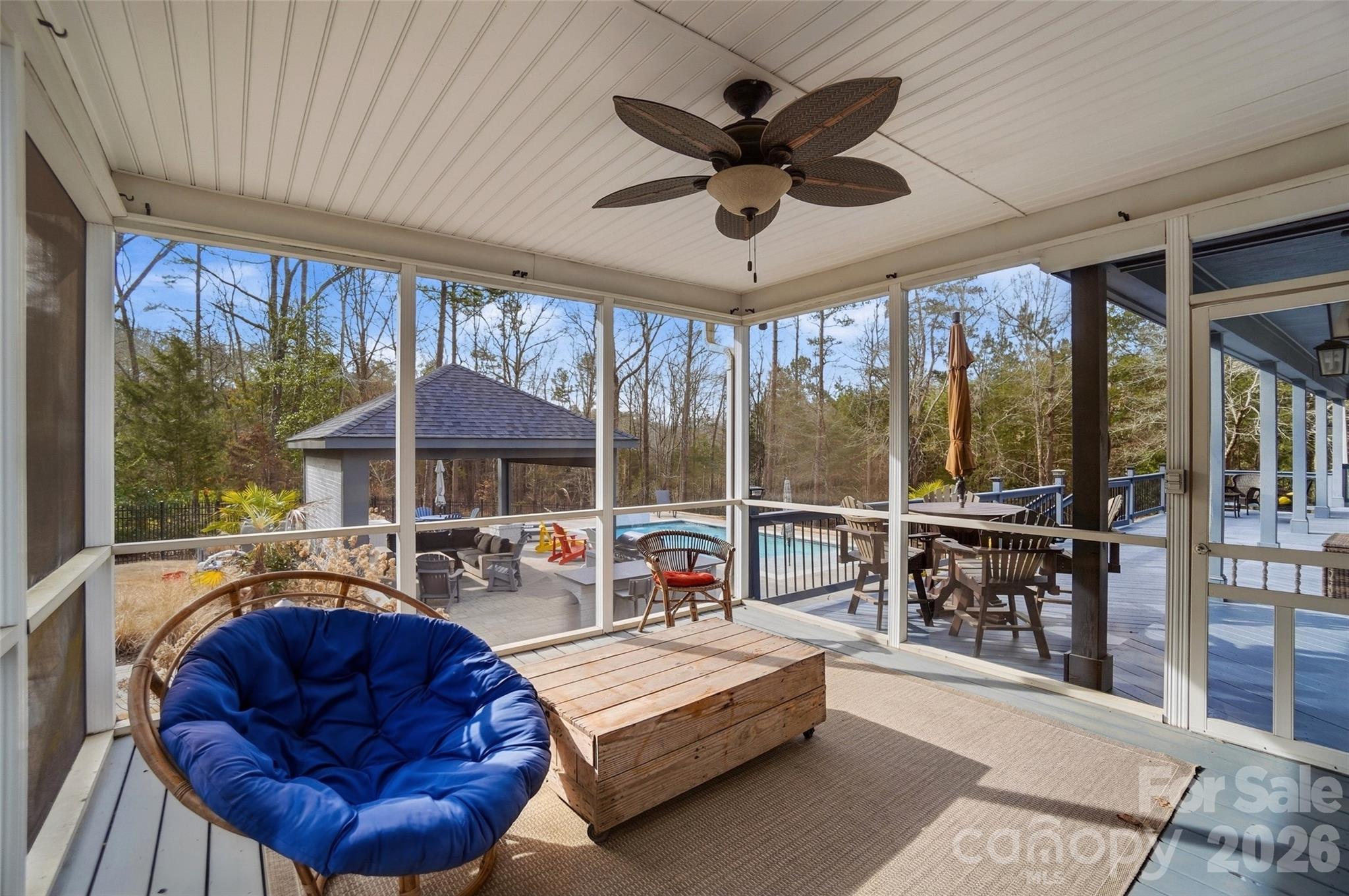 704 Mayfield Court Fort Mill, SC 29715 - Photo 41 of 48 a living room with furniture a ceiling fan and a large window