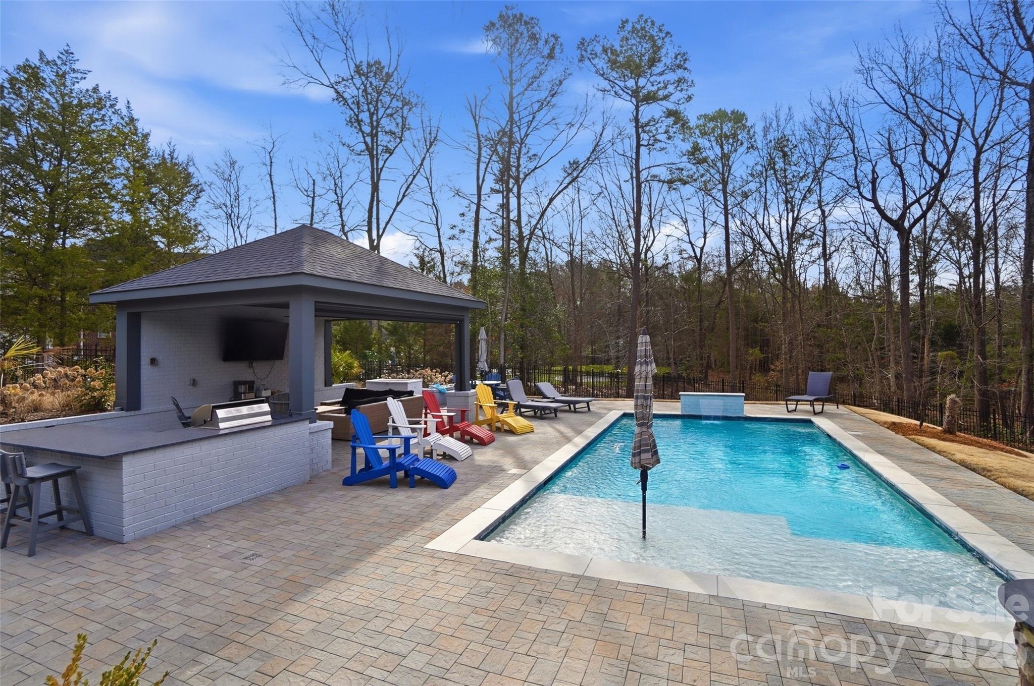 704 Mayfield Court Fort Mill, SC 29715 - Photo 42 of 48 a view of a house with swimming pool and sitting area