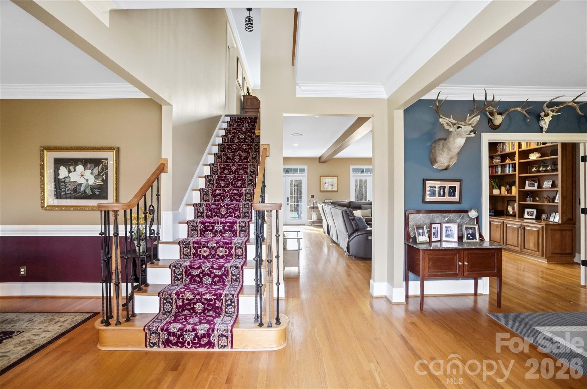 704 Mayfield Court Fort Mill, SC 29715 - Photo 7 of 48 a view of a hallway with wooden floor windows and entryway
