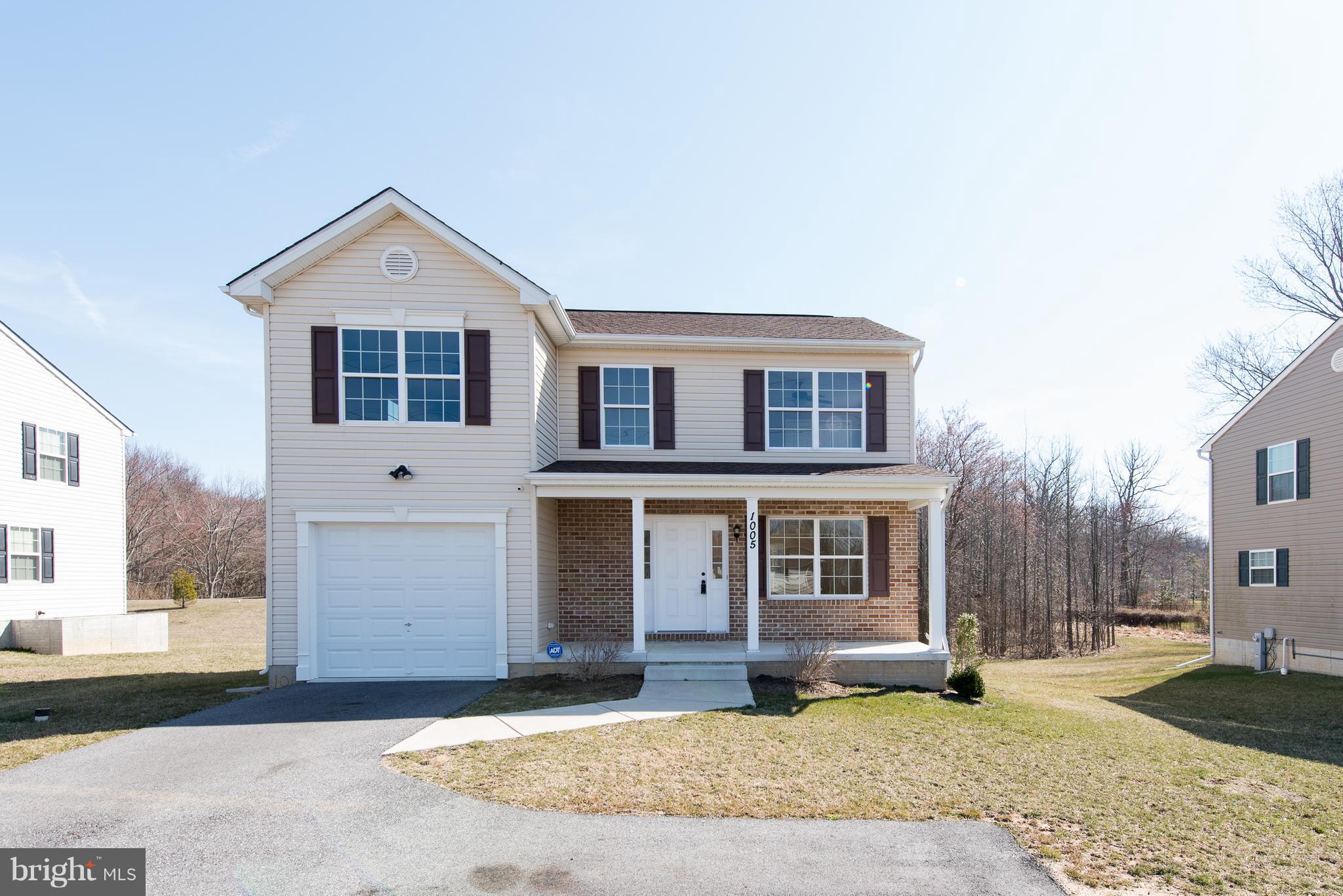 1005 Wampler Road Baltimore, MD 21220 - Photo 1 of 30 a front view of a house with a yard