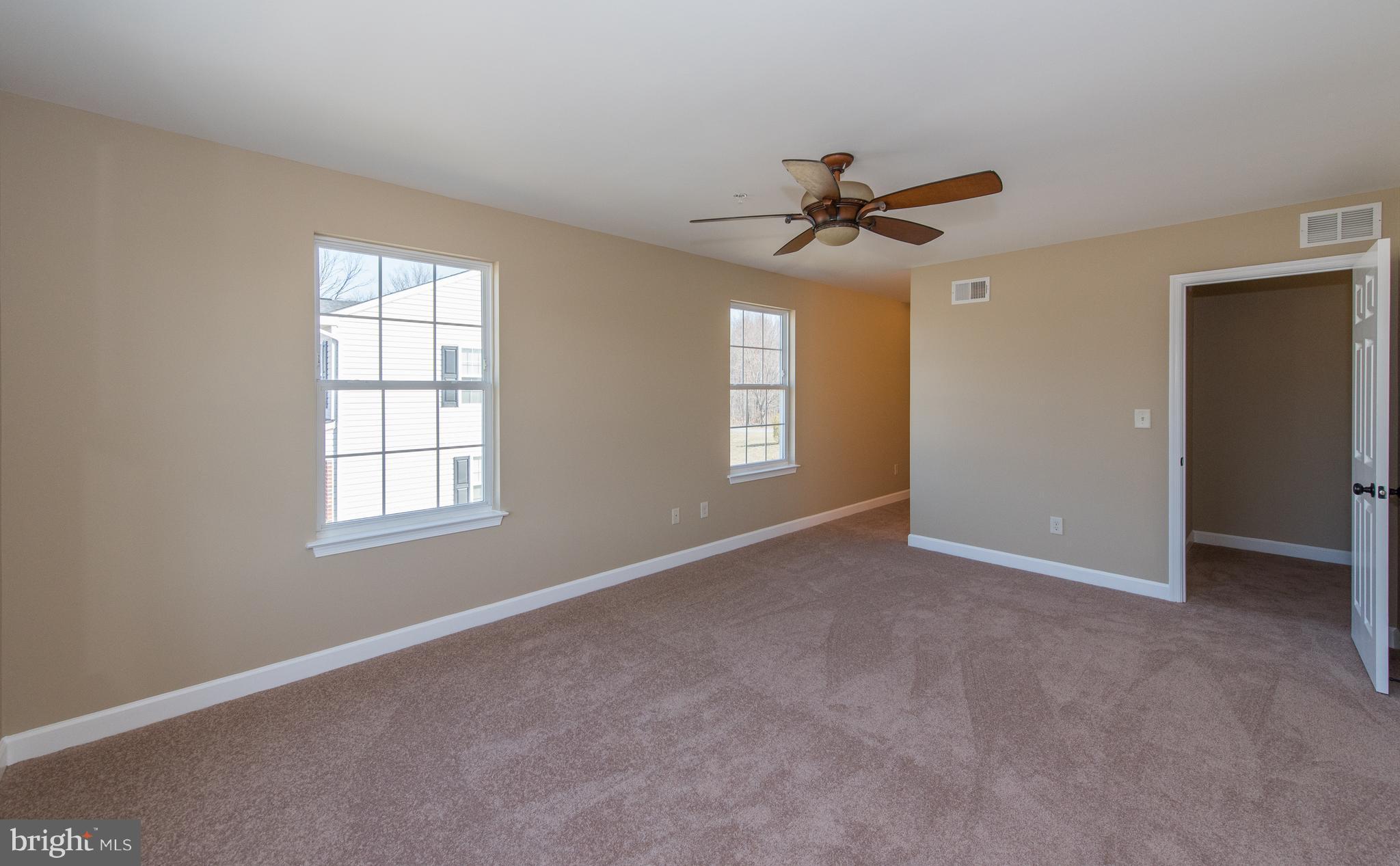 1005 Wampler Road Baltimore, MD 21220 - Photo 16 of 30 an empty room with windows and fan
