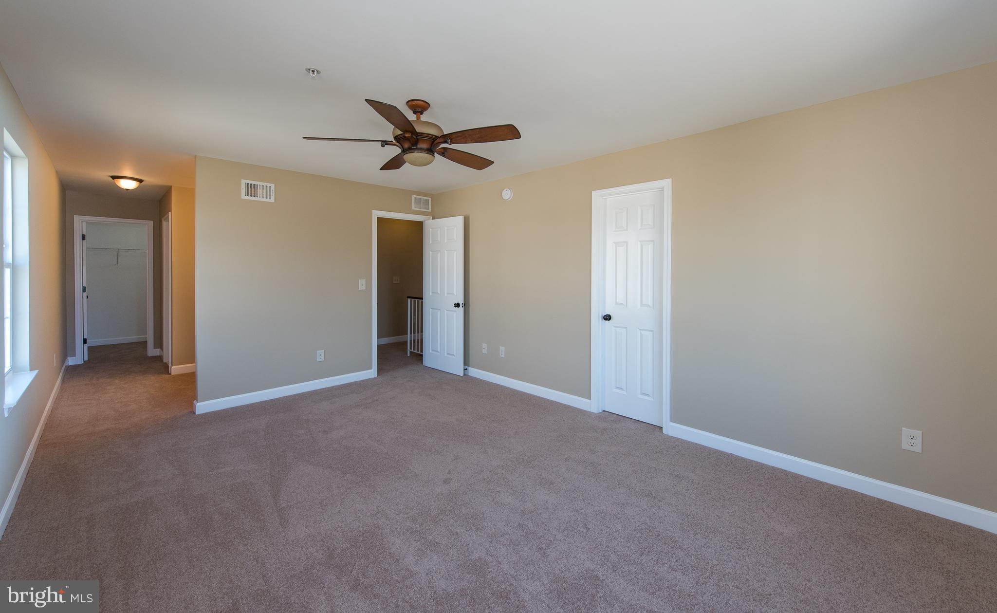 1005 Wampler Road Baltimore, MD 21220 - Photo 17 of 30 a view of a livingroom with a ceiling fan & entryway
