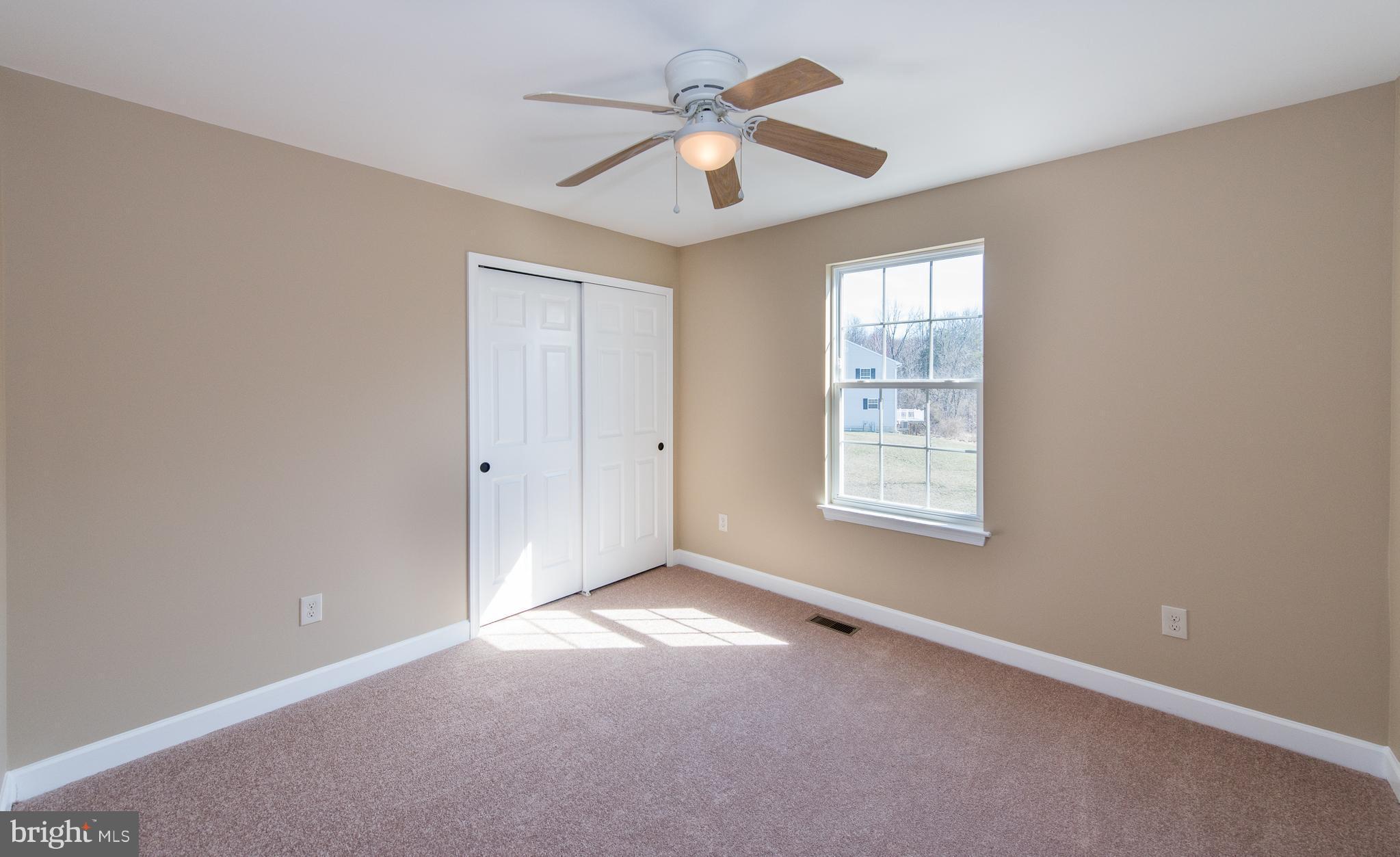 1005 Wampler Road Baltimore, MD 21220 - Photo 21 of 30 an empty room with fan and windows