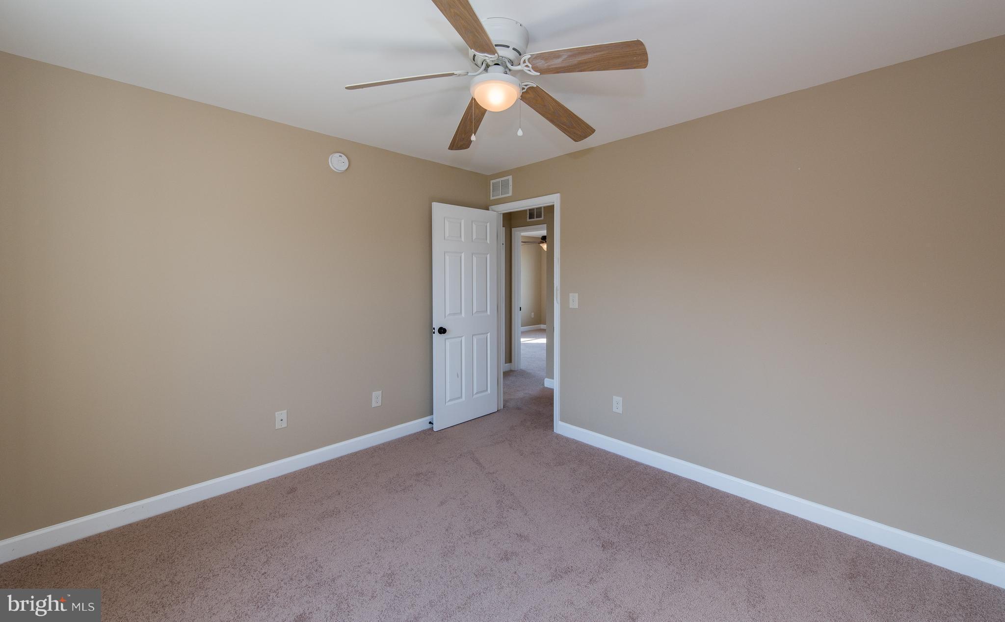 1005 Wampler Road Baltimore, MD 21220 - Photo 22 of 30 an empty room with a fan & a ceiling fan