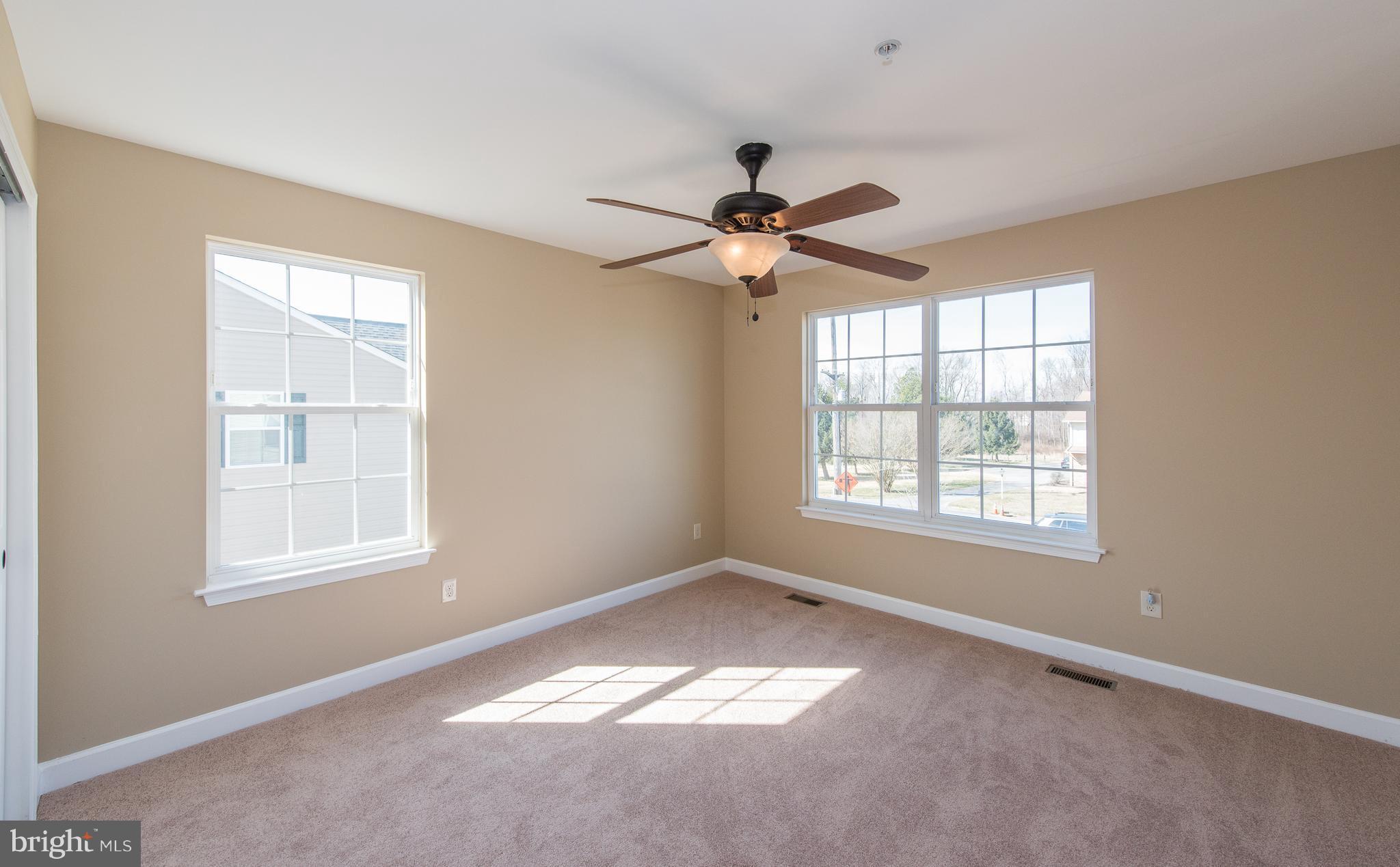 1005 Wampler Road Baltimore, MD 21220 - Photo 25 of 30 an empty room with a window and a fan