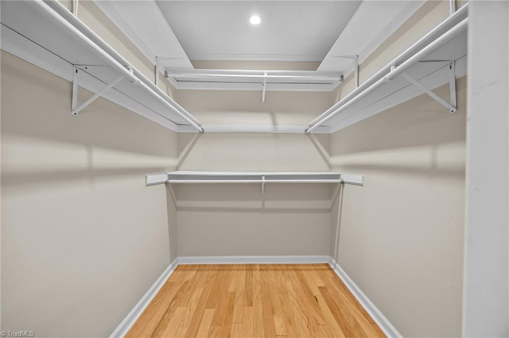 6922 Maynard Road Summerfield, NC 27358 - Photo 24 of 49 Walk in closet in primary bedroom