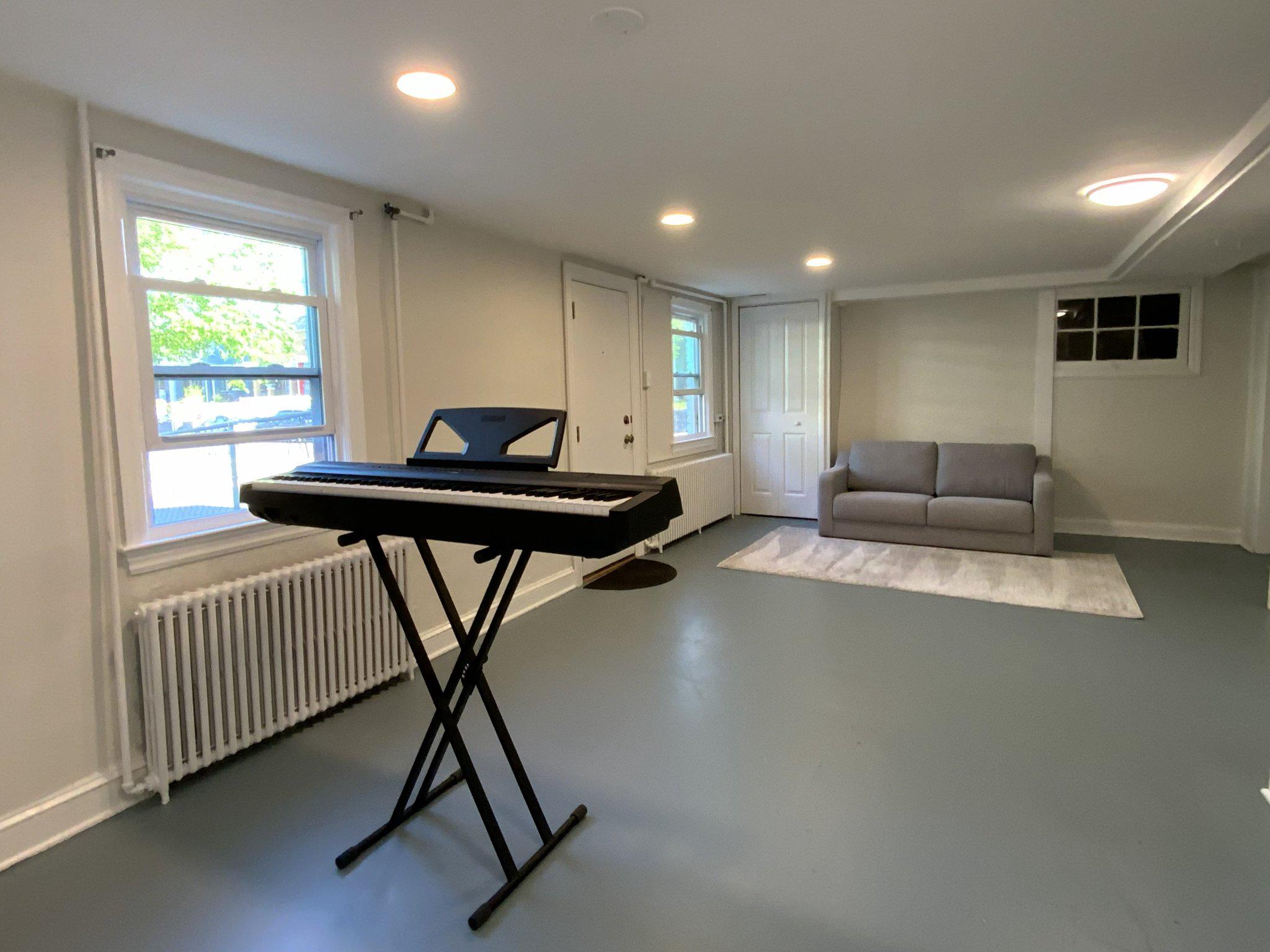 1772 E Street Northeast Washington, DC 20002 - Photo 19 of 23 a living room with furniture and a window