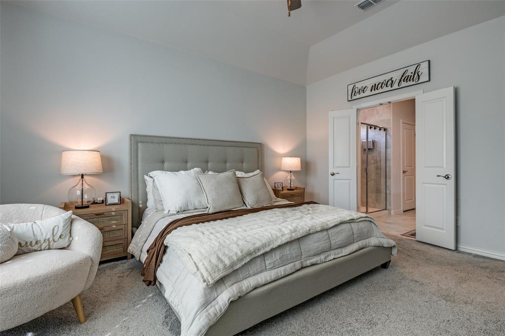 2419 Lalun Lane Forney, TX 75126 - Photo 15 of 25 a bedroom with a bed and a night stand