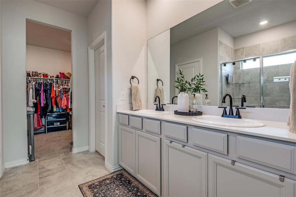 2419 Lalun Lane Forney, TX 75126 - Photo 16 of 25 a bathroom with a sink and a mirror
