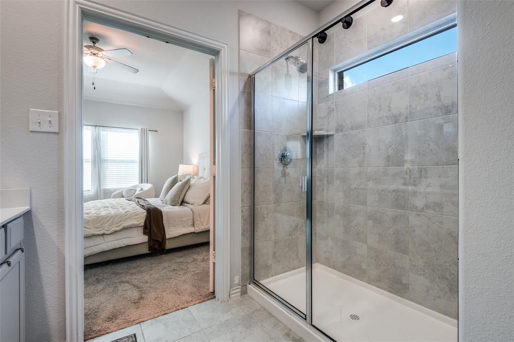 2419 Lalun Lane Forney, TX 75126 - Photo 17 of 25 a bedroom with a bed and a mirror