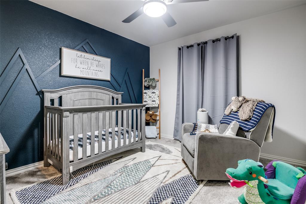 2419 Lalun Lane Forney, TX 75126 - Photo 19 of 25 a view of a bedroom with furniture and toys