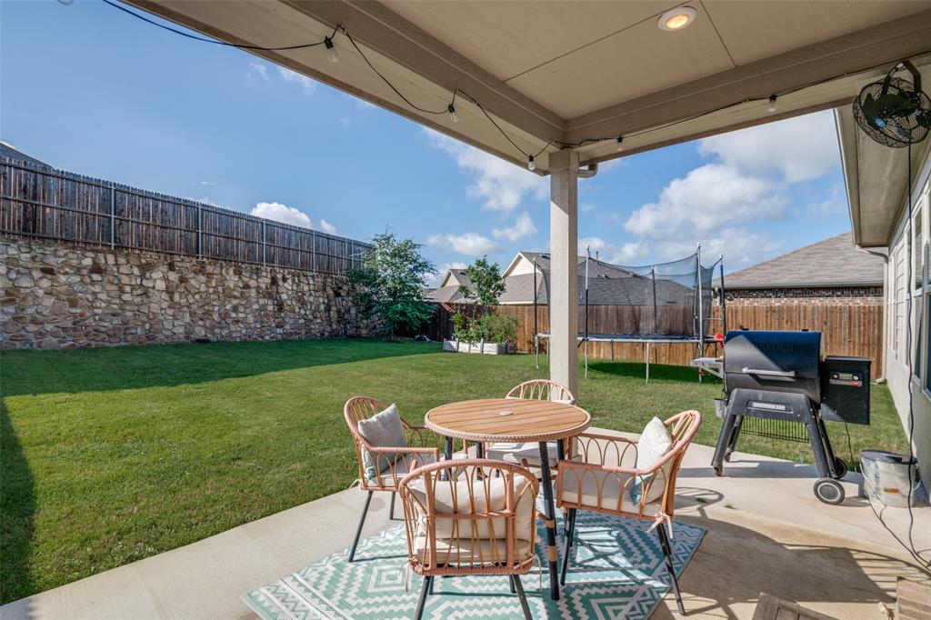 2419 Lalun Lane Forney, TX 75126 - Photo 24 of 25 a view of a chairs and backyard with a tub