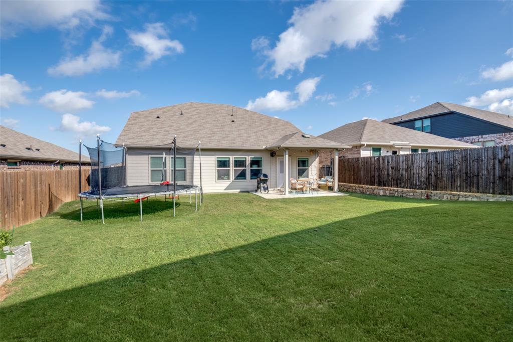 2419 Lalun Lane Forney, TX 75126 - Photo 25 of 25 a backyard of a house with table and chairs