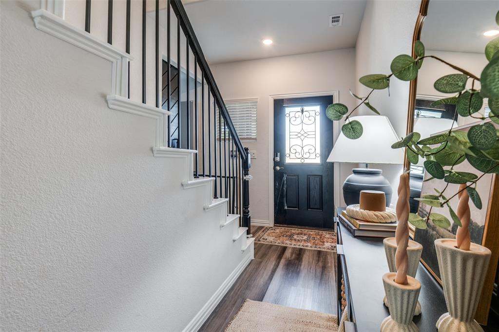 2419 Lalun Lane Forney, TX 75126 - Photo 4 of 25 a view of entryway and hall with wooden floor