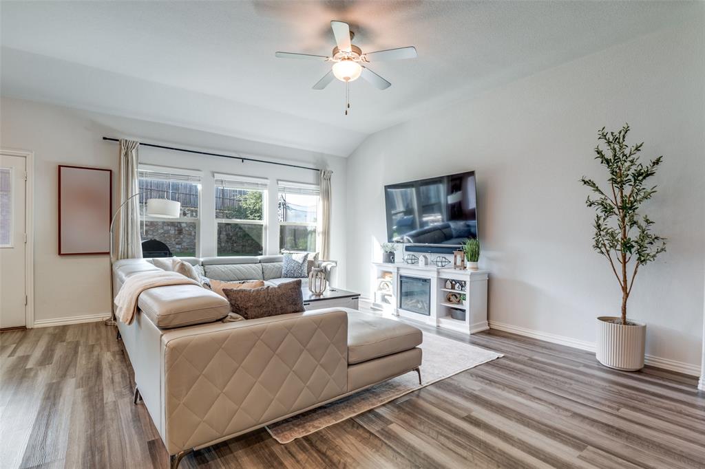 2419 Lalun Lane Forney, TX 75126 - Photo 6 of 25 a living room with furniture and a flat screen tv
