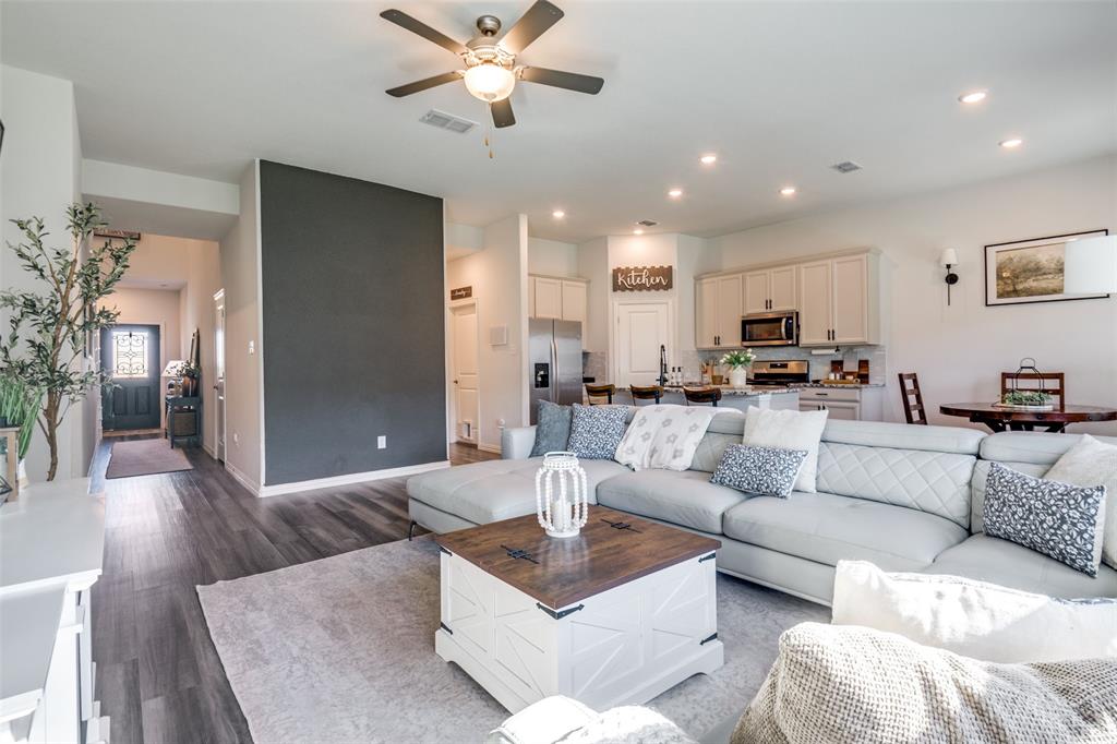 2419 Lalun Lane Forney, TX 75126 - Photo 8 of 25 a living room with furniture and a view of kitchen