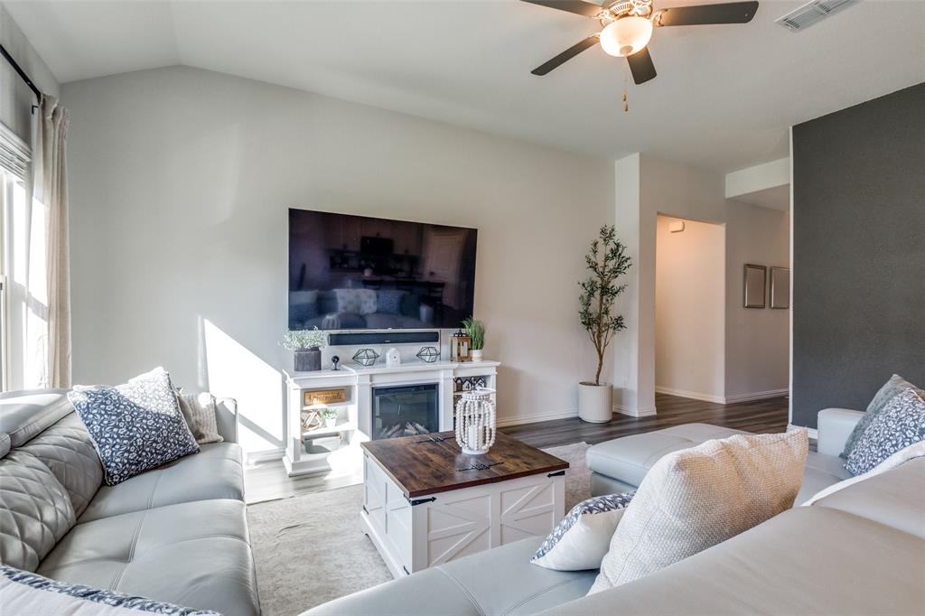 2419 Lalun Lane Forney, TX 75126 - Photo 9 of 25 a living room with furniture and a flat screen tv