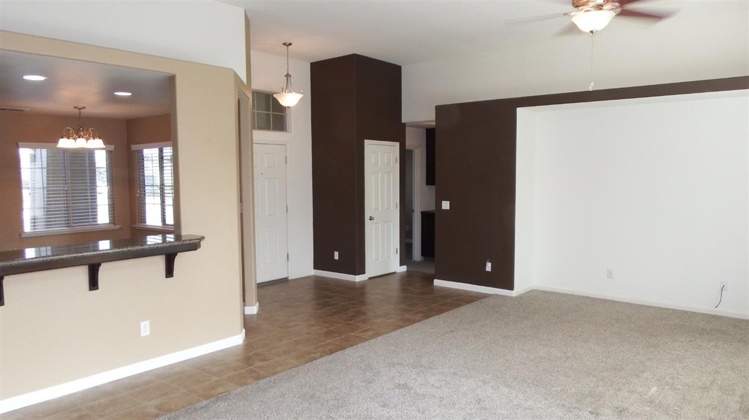 941 Marc Avenue Fowler, CA 93625 - Photo 4 of 11 an empty room with large mirror