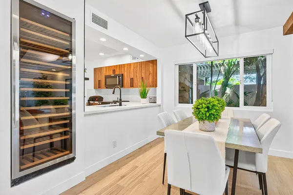 a kitchen with stainless steel appliances a sink and cabinets