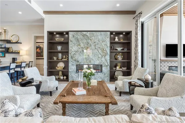a very nice looking living room with furniture and a large window