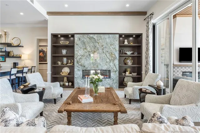 a very nice looking living room with furniture and a large window