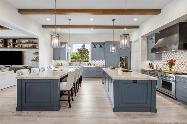 a living room with patio furniture and a floor to ceiling window