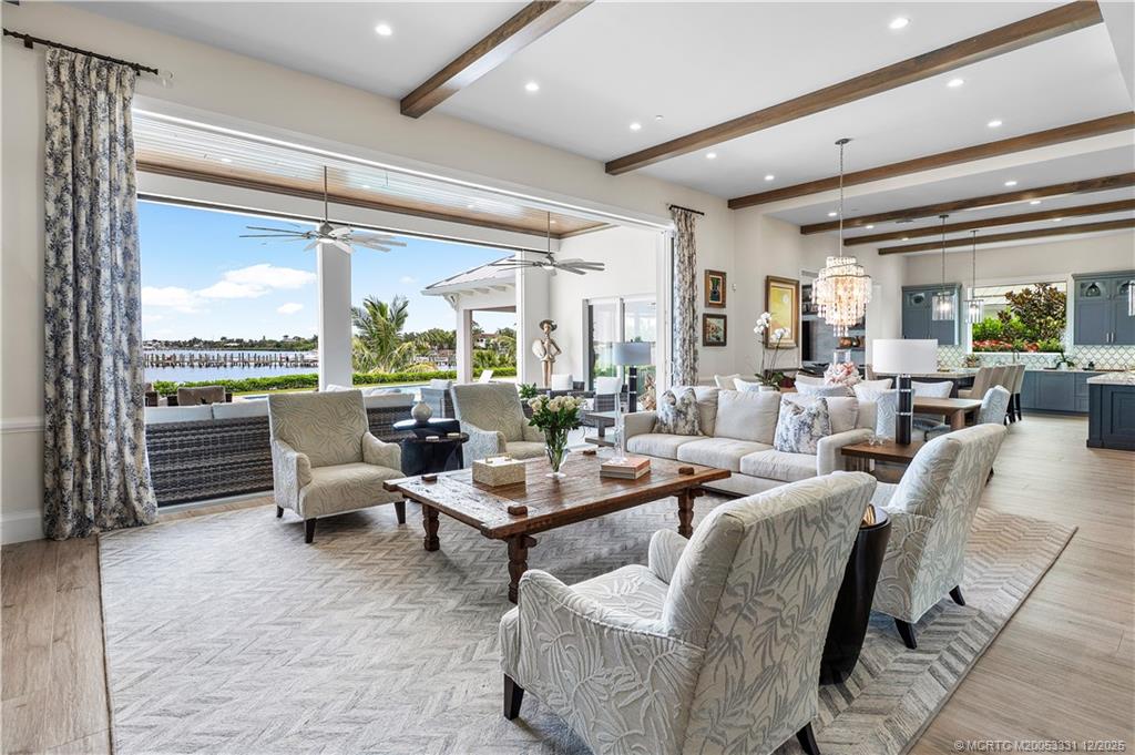 2842 Southwest Rivers End Way Palm City, FL 34990 - Photo 17 of 99 a very nice looking living room with furniture and a large window