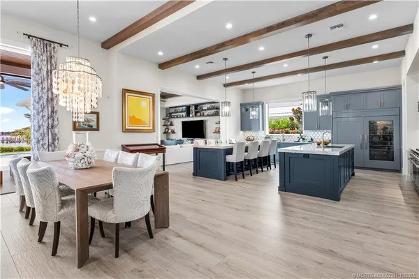 a view of a livingroom with couch and a flat screen tv