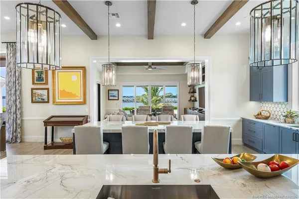 a spacious bathroom with a double vanity sink large mirror and bathtub