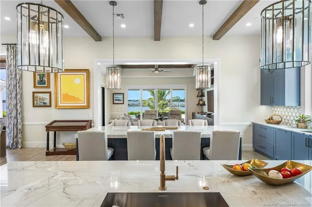 a spacious bathroom with a double vanity sink large mirror and bathtub