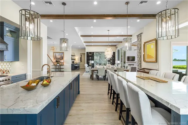 a spacious bathroom with a granite countertop double vanity and a mirror