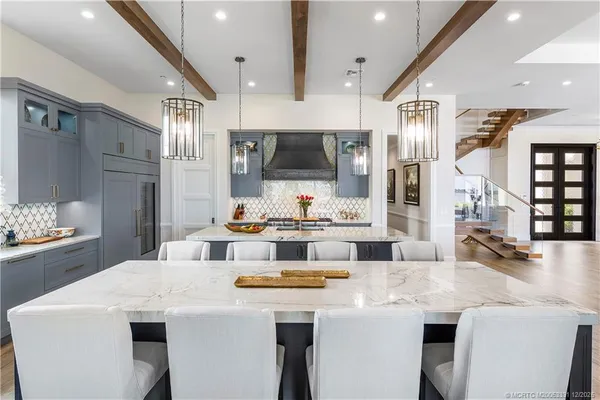 a view of a double vanity sink and a window