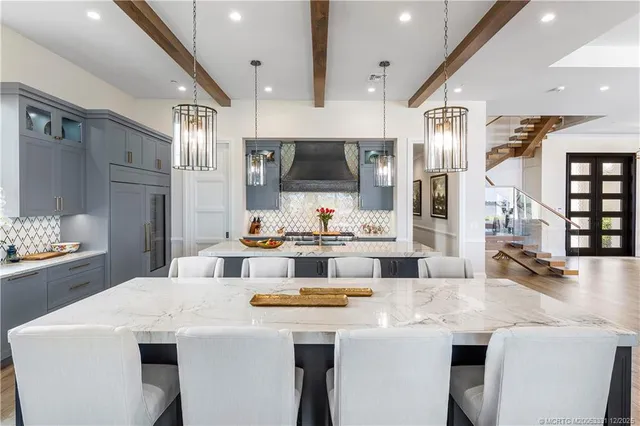 a view of a double vanity sink and a window