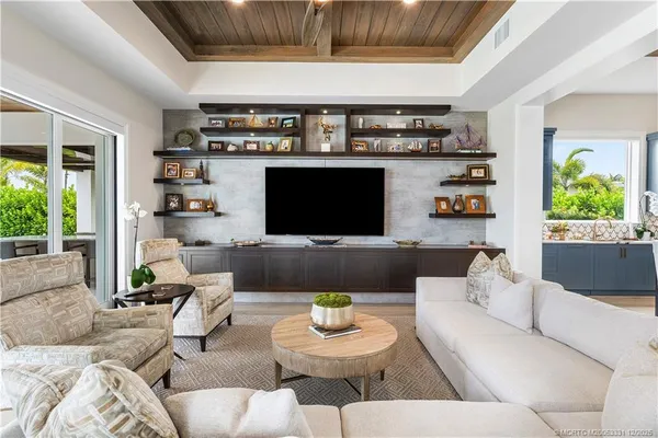 a bathroom with a double vanity sink a mirror and a window