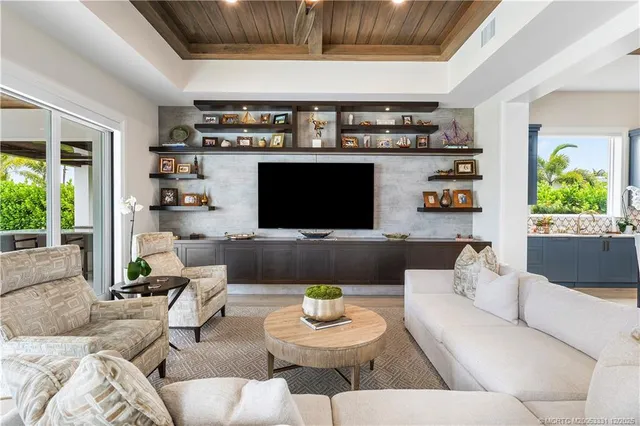 a bathroom with a double vanity sink a mirror and a window