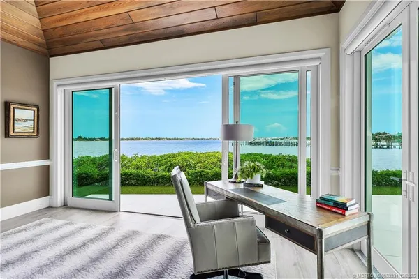 a outdoor space with patio the couches and a fireplace