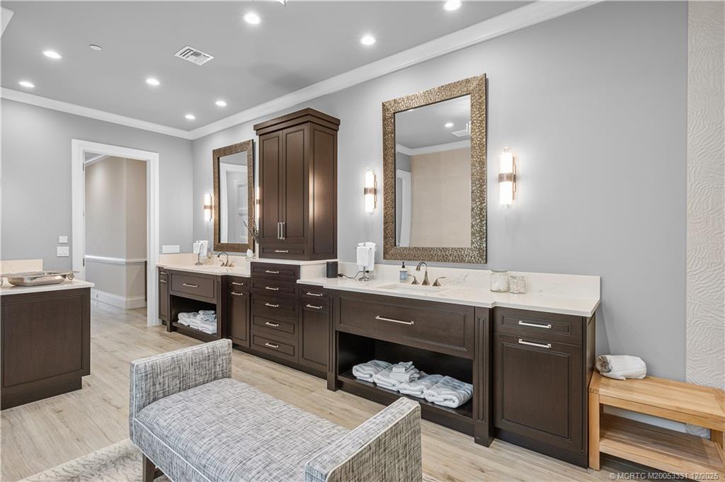 2842 Southwest Rivers End Way Palm City, FL 34990 - Photo 38 of 99 a spacious bathroom with a granite countertop double vanity and a mirror