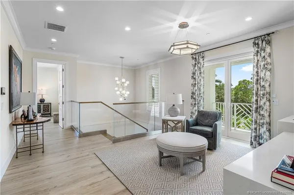 an aerial view of a house with a lake view