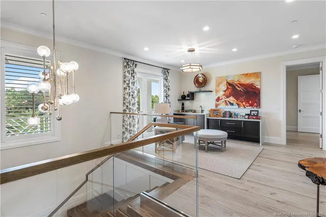 an aerial view of a house with a yard and potted plants