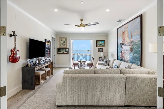 an aerial view of residential houses with outdoor space and swimming pool