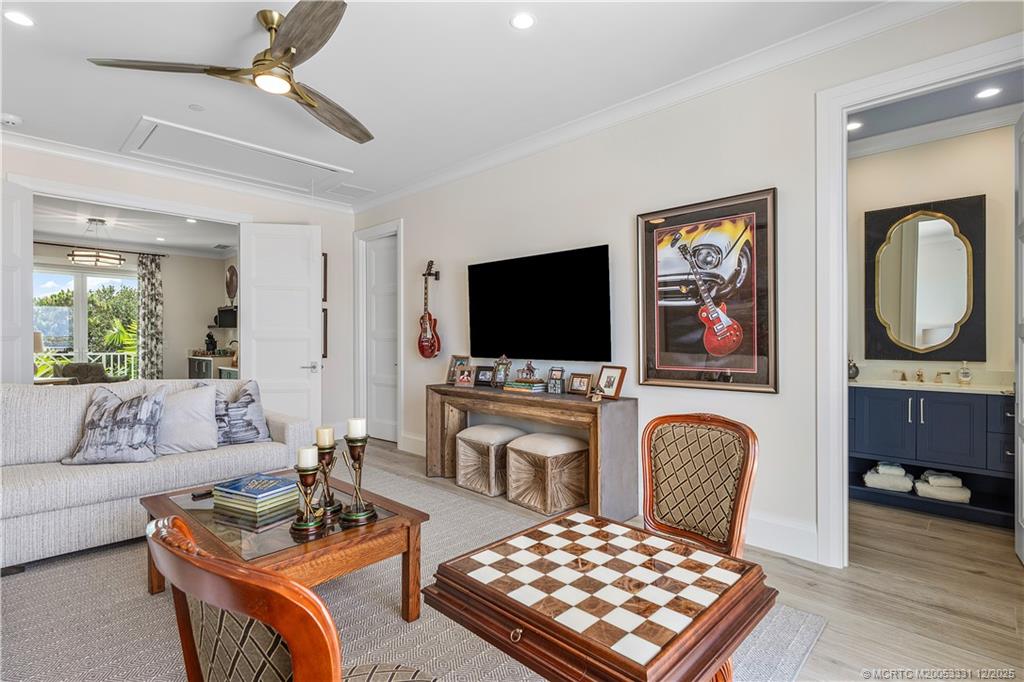 2842 Southwest Rivers End Way Palm City, FL 34990 - Photo 50 of 99 a living room with furniture and a flat screen tv