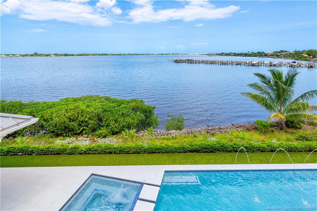 2842 Southwest Rivers End Way Palm City, FL 34990 - Photo 57 of 99 a view of a lake with a city view