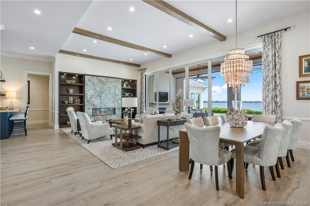 2842 Southwest Rivers End Way Palm City, FL 34990 - Photo 7 of 99 a view of a dining room with furniture window and wooden floor