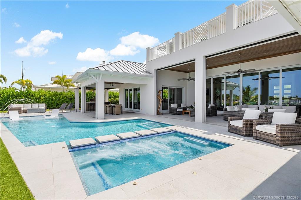 2842 Southwest Rivers End Way Palm City, FL 34990 - Photo 78 of 99 a view of a house with backyard porch and sitting area