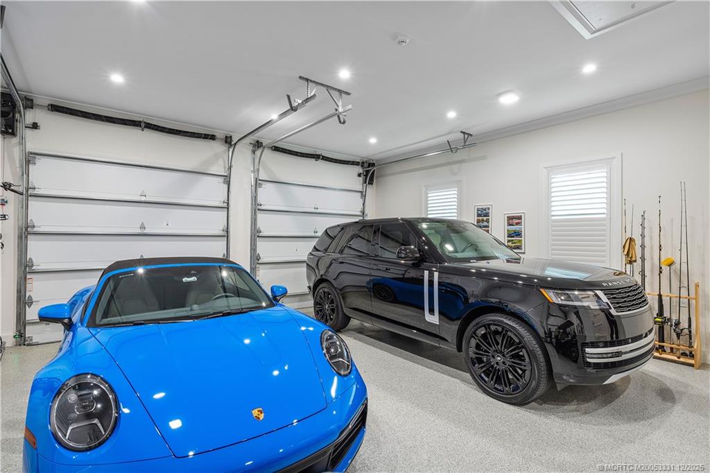 2842 Southwest Rivers End Way Palm City, FL 34990 - Photo 84 of 99 a car parked in a garage