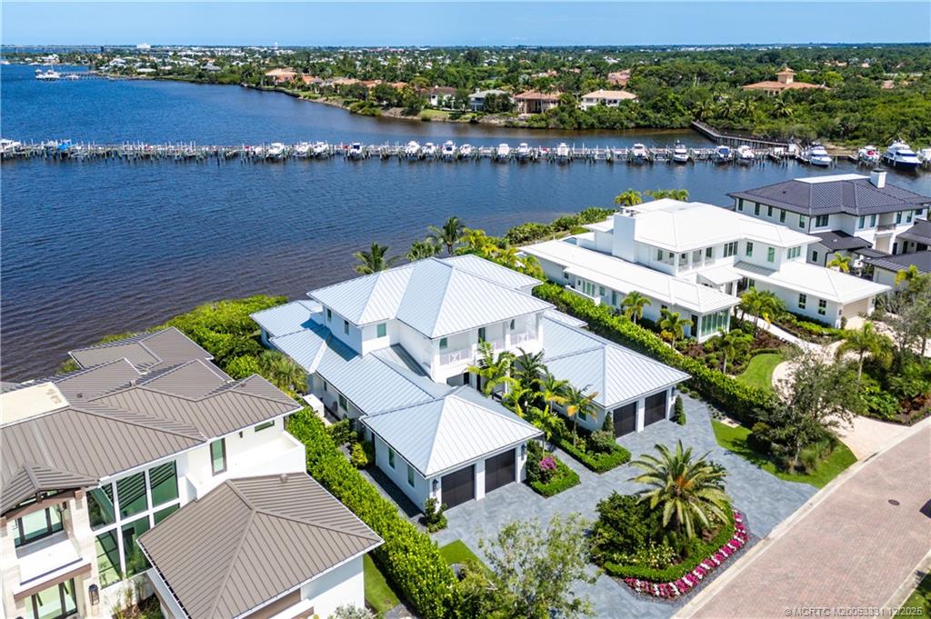 2842 Southwest Rivers End Way Palm City, FL 34990 - Photo 88 of 99 an aerial view of a house with a lake view