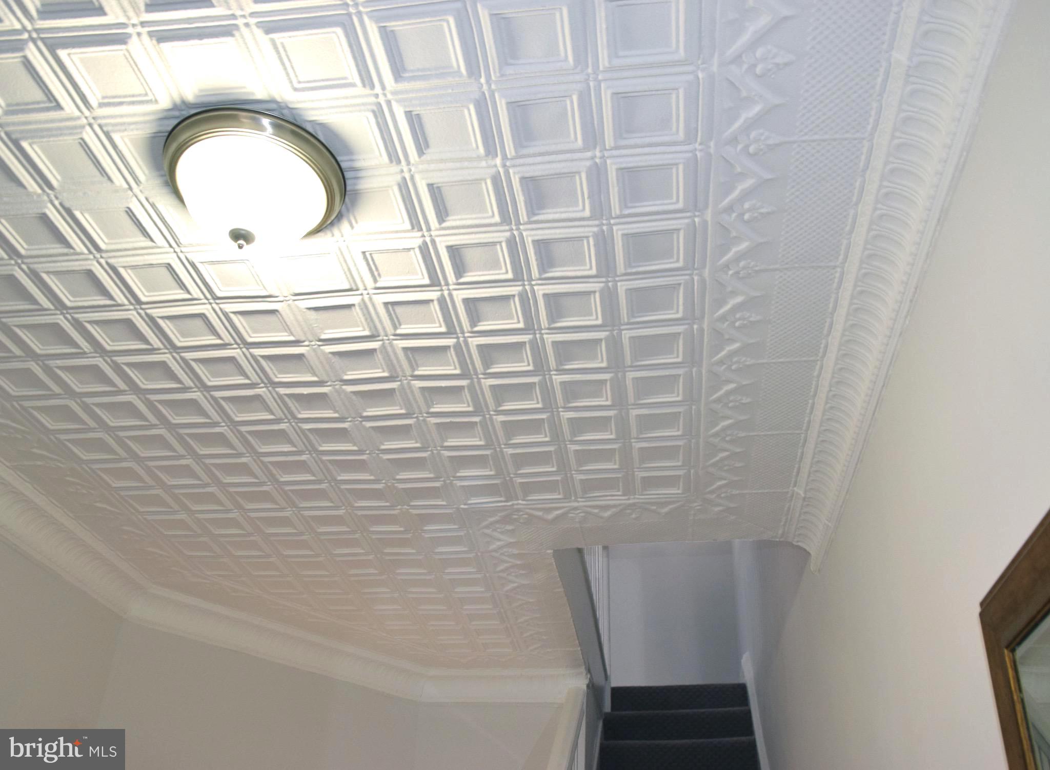 607 Columbia Road Northwest Washington, DC 20001 - Photo 14 of 48 Front foyer elegant pressed tin ceiling