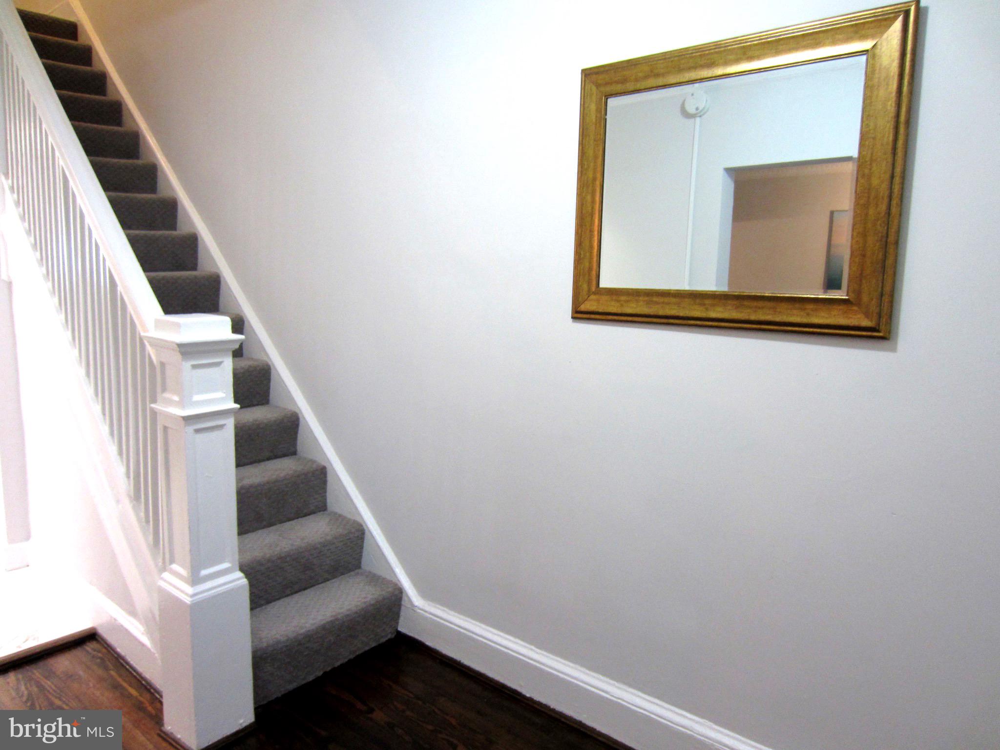 607 Columbia Road Northwest Washington, DC 20001 - Photo 5 of 48 Front foyer and upper stairway